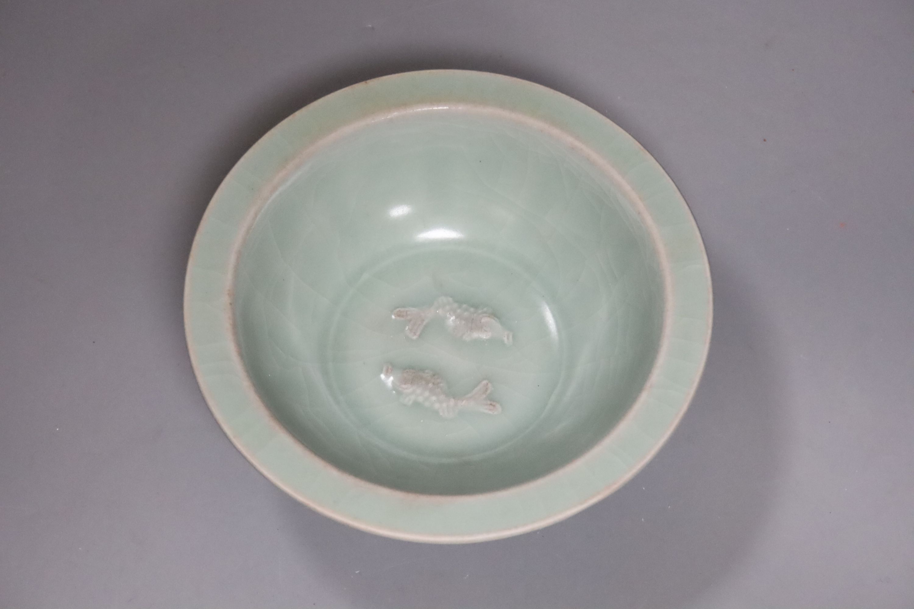 A Chinese Longquan style celadon twin fish dish, diameter 15.5cm